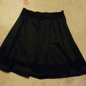 Black, flowy skirt.